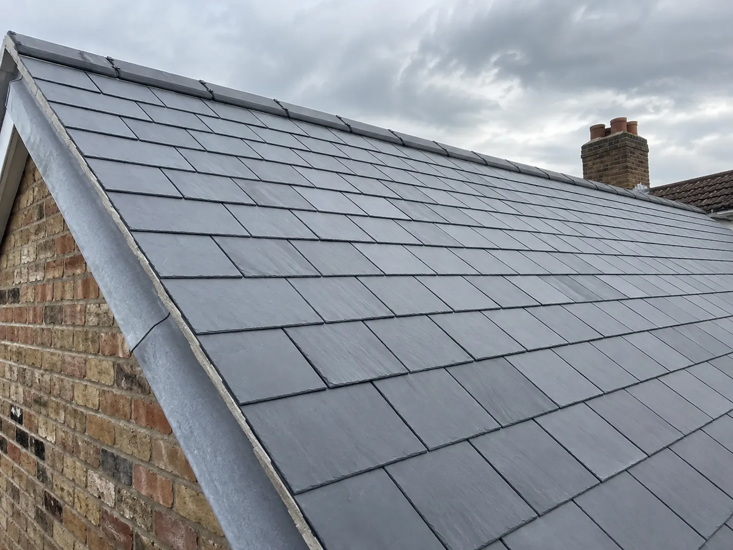 Slate roof with lead verge showing the kind of detail that affects a roofing quote