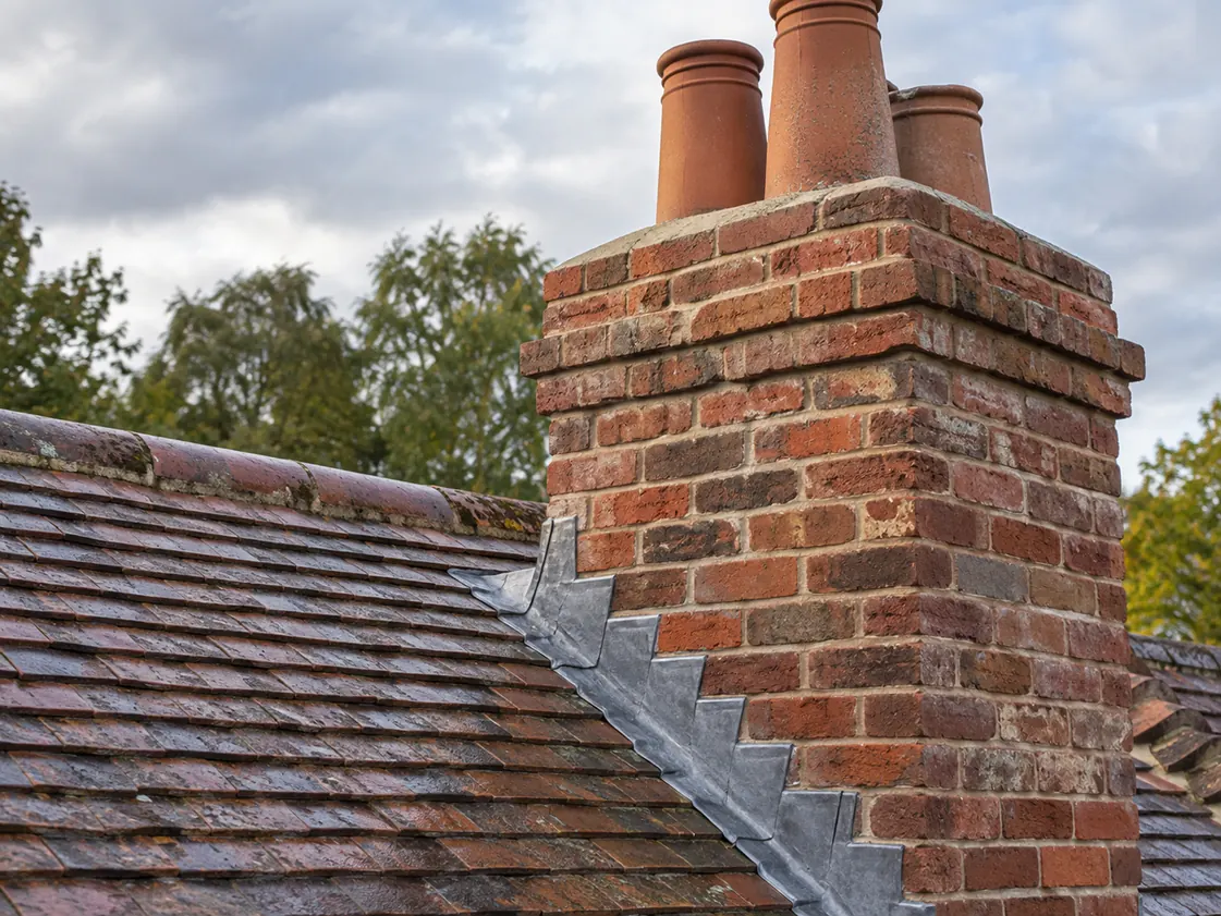 Completed brick chimney and stepped lead flashing repair
